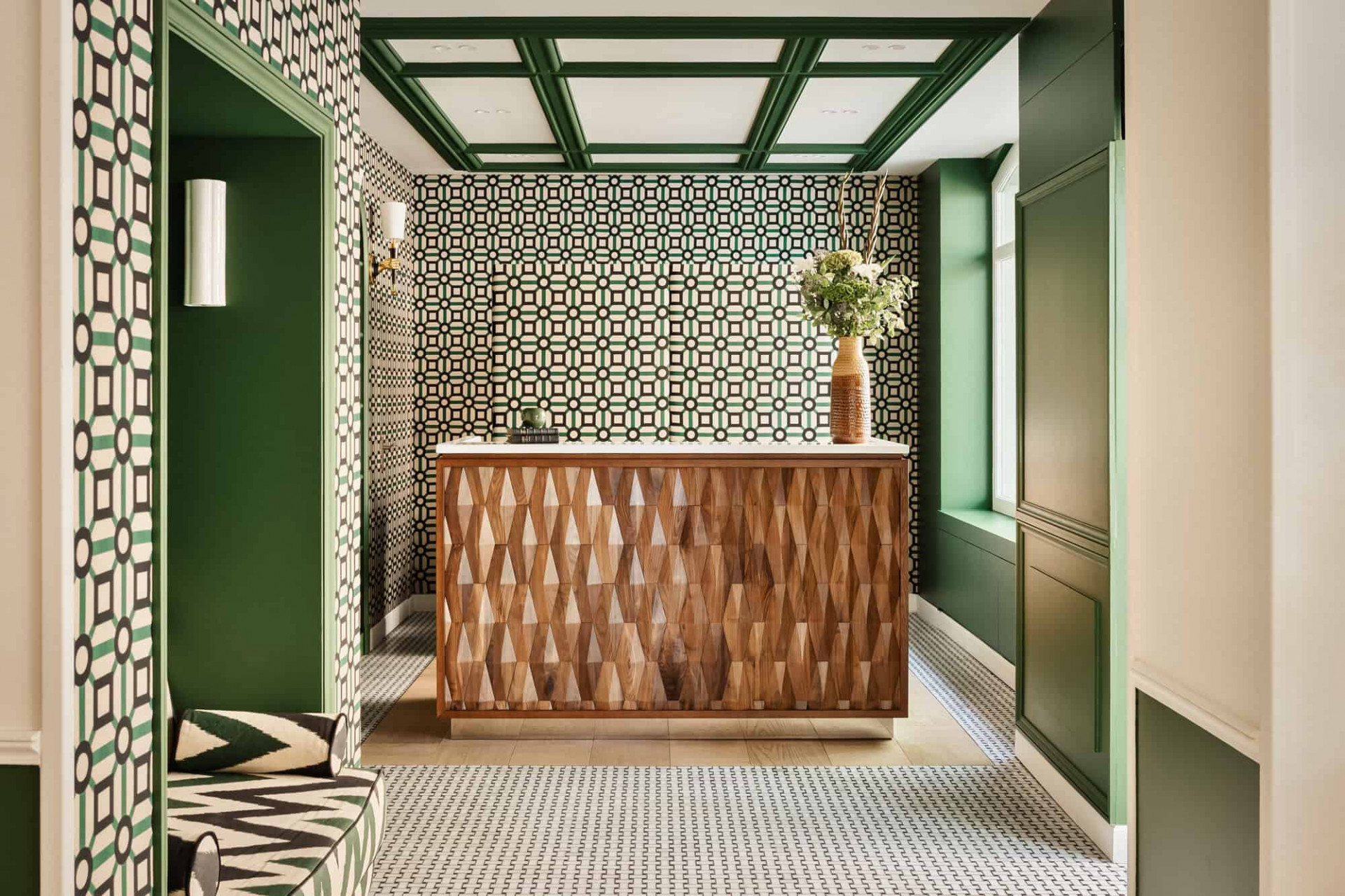 The elegant hotel lobby and reception with white and green tiles at Hôtel Observatoire Luxembourg 